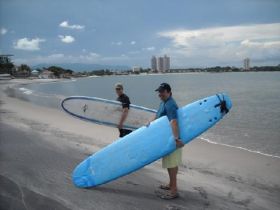 Two surfers on the beach in Coronado Panama – Best Places In The World To Retire – International Living